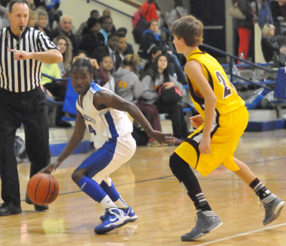 Simeon Watson pushes the ball past Lake Hamilton defender Stefan Dailey. (Photo by Kevin Nagle)