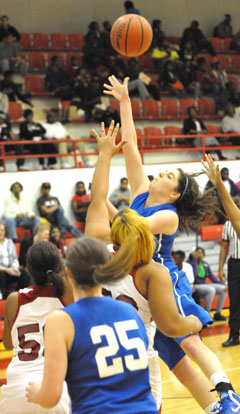 Courtney Davidson powers up a shot inside. (Photo by Kevin Nagle)