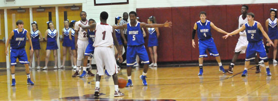 Bryant's Tyler Simmons (1), Brian Reed (back), K.J. Hill (5), Luke Rayburn (4) and Skyler McKissock (2) deplay in a zone defense against Xzavian Solomon (1) and the Texarkana Razorbacks. (Photo by Kevin Nagle)