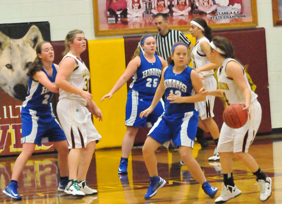 Kara Moser, Anna Turpin and Britney Sahlmann defend. (Photo by Kevin Nagle)