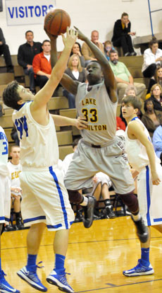 Bryant's Zach Cambron (44) defends against Lake Hamilton's Malik Blevins. (Photo by Kevin Nagle)