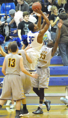 Brian Reed (35) shoots over Lake Hamilton's Malik Blevins (33). (Photo by Kevin Nagle)