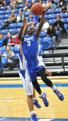 Calvin Allen drives to the basket. (Photo by Kevin Nagle)