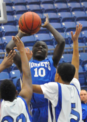 Caylin Allen shoots in a crowd. (Photo by Kevin Nagle)