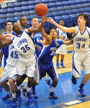 Bryant's Trey Harris (24) battles for a loss ball. (Photo by Kevin Nagle)