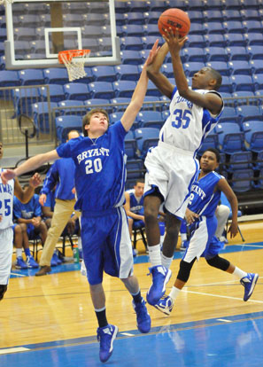 Evan Lee (20) defends against Conway White's Prentice Mullins. (Photo by Kevin Nagle)