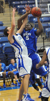 Bryant's Cameron Murray tries to power up a shot over Conway White's Blaine Booher. (Photo by Kevin Nagle)