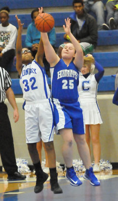 Anna Turpin (25) battles with Conway White's Dalia Brown for a rebound. (Photo by Kevin Nagle)