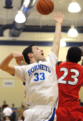 Clay Ingold fights for a rebound with Cabot South's Will Samuels (23). (Photo by Kevin Nagle)