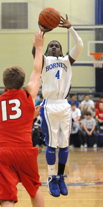 Simeon Watson (4) goes up for a shot over Cabot South's Sawyer Stalnaker. (Photo by Kevin Nagle) Simeon Watson (4) goes up for a shot over Cabot South's Sawyer Stalnaker. (Photo by Kevin Nagle)