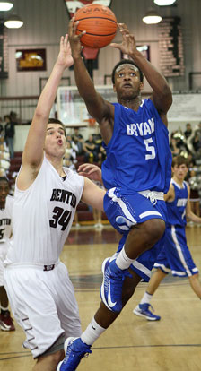 K.J. Hill (5) drives past Benton's Graham Gardner on the way to the basket. (Photo by Rick Nation)