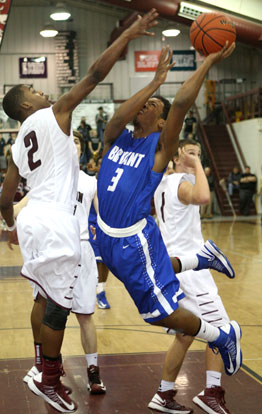 Bryant's C.J. Rainey (3) runs into Benton's Tarek Beaugard on the way to the basket. (Photo by Rick Nation)