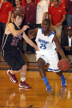 Greyson Giles (25) drives around Benton's Zach Stuckey. (Photo by Rick Nation)