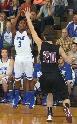 C.J. Rainey (3) shoots over Benton's Josh Bowling. (Photo by Rick Nation)