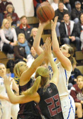 Erica Smith shoots over a pair of Benton defenders. (Photo by Kevin Nagle)