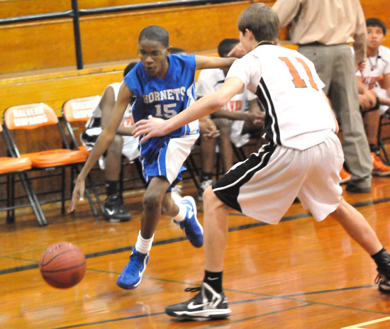 Chris Adams (15) drives past a Malvern defender. (Photo by Kevin Nagle)