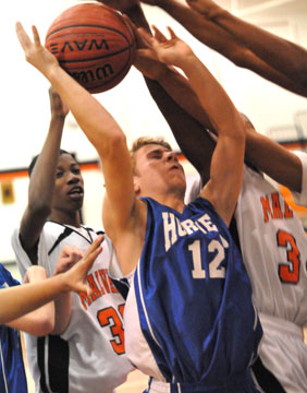 Chase Kincaid (12) goes up for a shot in traffic. (Photo by Kevin Nagle)