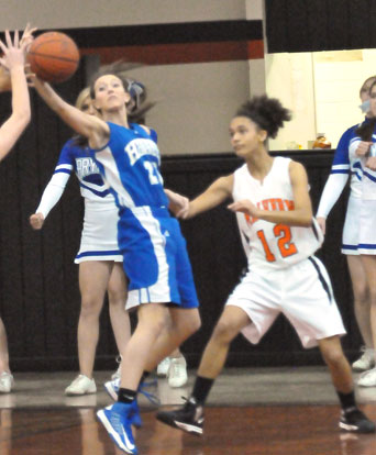 Bryant's Kailey Nagle, left, reaches back for a rebound. (Photo by Kevin Nagle)