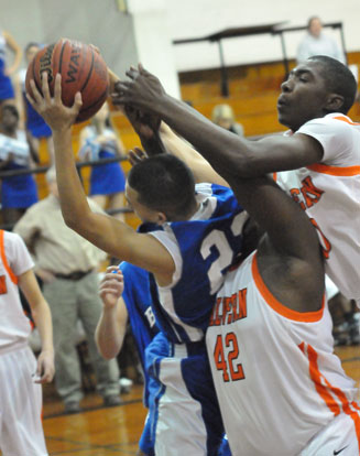 Jordan Walker fights for one of his six rebounds in Monday's game. (Photo by Kevin Nagle)