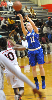 Logan Davis fires a jumper. (Photo by Kevin Nagle)