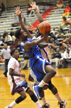 K.J. Hill goes to the hoop. (Photo by Kevin Nagle)