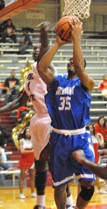 Bryant's Brian Reed goes up for a shot inside. (Photo by Kevin Nagle)