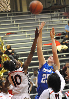 Erica Smith tries to get a shot up in a crowd. (Photo by Kevin Nagle)