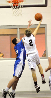 Bryant's Hayden Knowles, left, goes for the block. (Photo by Kevin Nagle) Bryant's Hayden Knowles, left, goes for the block. (Photo by Kevin Nagle)