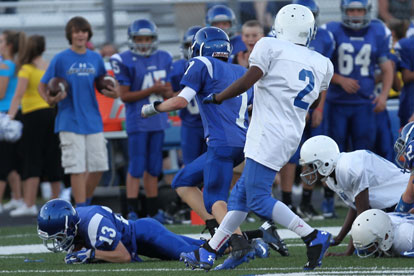 Jacob Thomason recovers a North Little Rock East fumble. (Photo by Rick Nation)