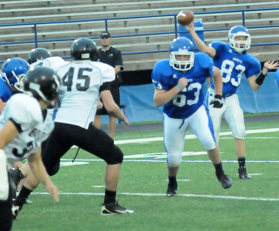 Jordan Gentry tosses a pass  as Zack Knapp (63) runs interference. (Photo by Kevin Nagle)