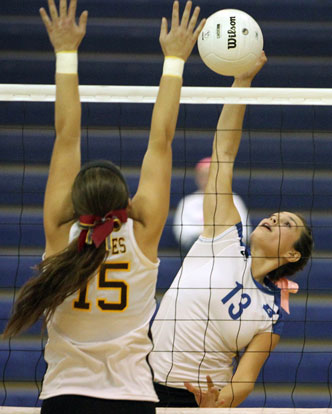 Mariah Aguilar (13) tries to get a hit past a Lake Hamilton defender. (Photo by Rick Nation)