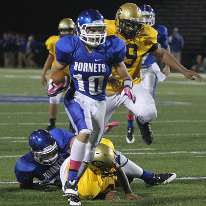 Bryant's Austin Kelly slips a tackle on his way to a touchdown. Kelly caught seven passes for 173 yards and two scores in Thursday's win. (Photo by Rick Nation)