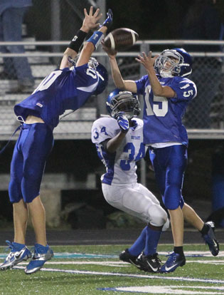 Bryant Blue's Mike Jones (10) and Clayton Guthrie (15) leap for a pass intended for Bryant White's Keshaun Davis (34). (Photo by Rick Nation)