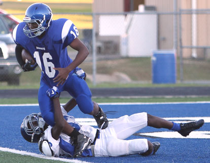 Bryant White's A.J. Todd nearly brings down Bryant Blue's Jonathan Smith (16) for a safety. (Photo by Rick Nation)