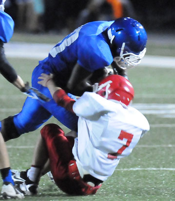 Cameron Coleman, who rushed for 117 yards and a touchdown, bowls over Cabot South's Braxton Burton. (Photo by Kevin Nagle)