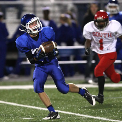 Jake East pulls in a pass on the way to one of his two touchdown receptions. (Photo by Rick Nation)