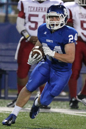 Bryce Denker returns an interception that was negated by a penalty. (Photo by Rick Nation)