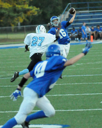 Bryant White quarterback Tristan Calhoun (16) throws past Little Rock Henderson's Byron Bryant (27) towards Neal Brenton (10). (Photo by Kevin Nagle)