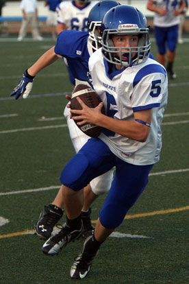 Seth Tage (5) turns upfield after grabbing a pass that he turned into a touchdown. (Photo by Rick Nation)