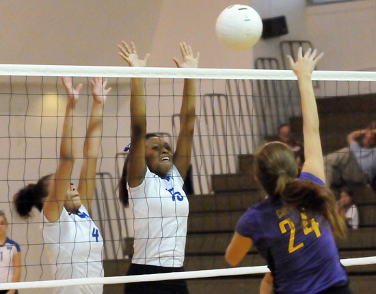 Savannah Shelton (4) and Dejai Kelley try to block a Fountain Lake hit. (Photo by Kevin Nagle)