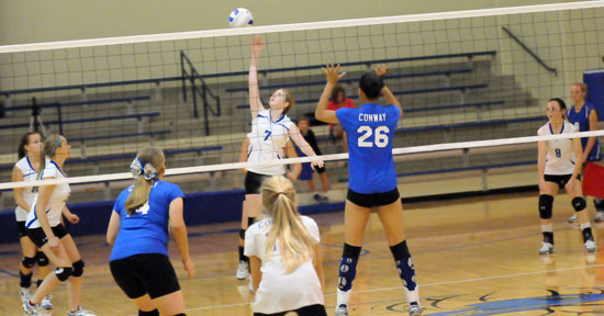 Brooke Snyder goes up for a hit in front of teammate Brianna Ware (8). (Photo by Kevin Nagle)