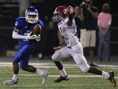 Bryant's Brushawn Hunter hauls in a pass in front of Pine Bluff's Jayshon Williams (12). (Photo by Rick Nation)