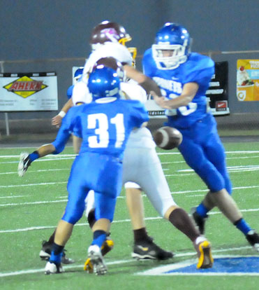 Kaleb Kling (31) forces a fumble that Aaron Eley recovered. (Photo by Kevin Nagle)