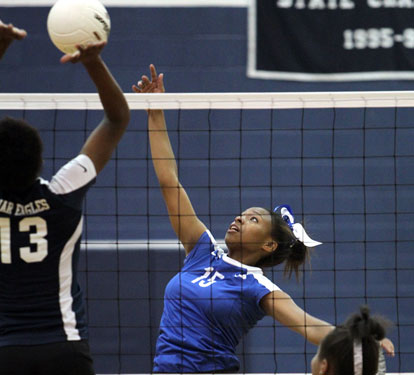Dejai Kelley sends a hit over the net during Tuesday's match. (PHoto by Rick Nation)