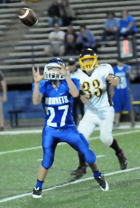 Colin Welch (27) eyes the interception he returned 40 yards for a touchdown. (Photo by Kevin Nagle)