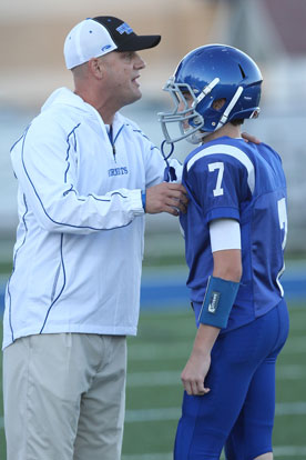 Bethel Hornets head coach Dale Jones gives instructions to his quarterback Cameron Vail during Thursday's game. (Photo by Rick Nation)