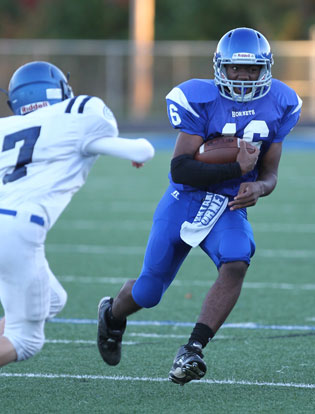 Jonathan Smith (16) maneuvers around a Conway White defender on the way to a 48-yard touchdown run. (Photo by Rick Nation)