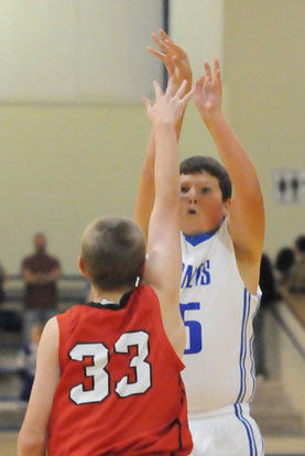 Bryant's Brandon Hopkins shoots over Vilonia's Trey McNespy. (Photo by Kevin Nagle)