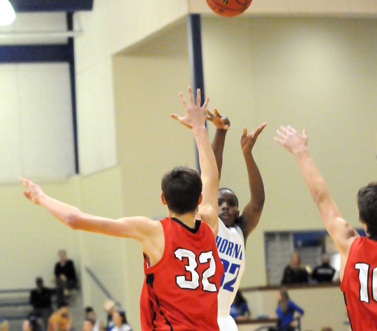 Jonathan Allen fired up a shot over Vilonia's Matt Stanley. (Photo by Kevin Nagle)