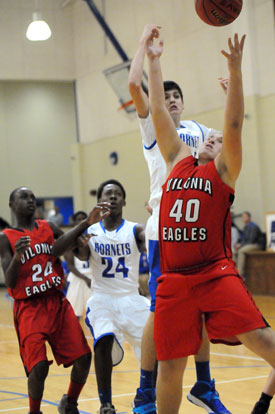 Kyle Sahr goes after the ball over Vilonia's Matt Foster (40) as Bryant's Marvin Moody (24) and Vilonia's Nalik Burton contend for position. (Photo by Kevin Nagle)